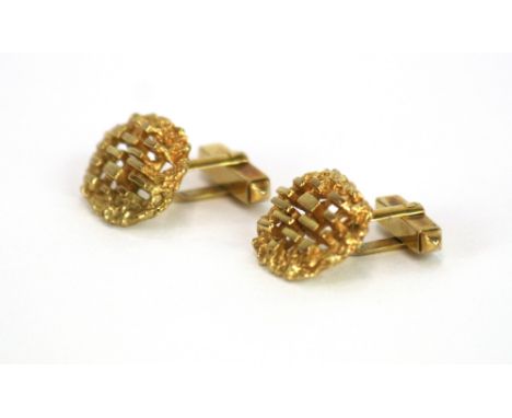 A pair of yellow metal cufflinks, marks rubbed