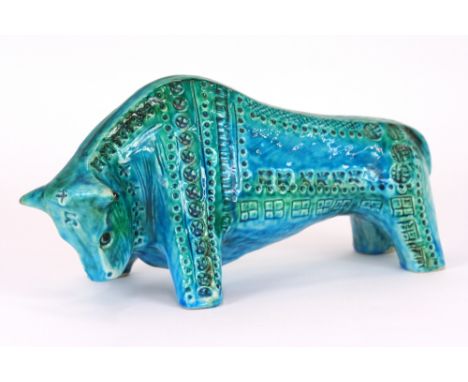 A pottery model of a stylised bull, with all over blue and turquoise glaze, signed to base 'Jema Holland '79', 18cm high