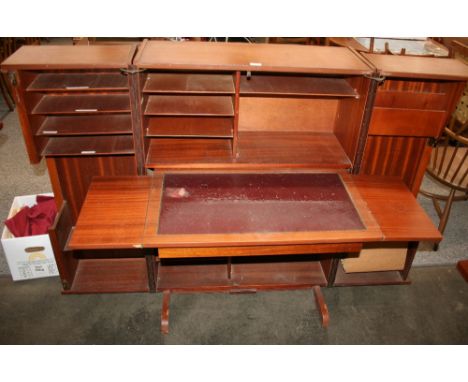 A teak compact folding desk, doors enclosing fitted interior and pull out drop leaf writing surface, 112cm high, 83cm wide, 5