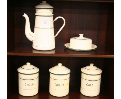 A collection of French enamel ware to include three storage jars; butter dish and cover and a coffee pot