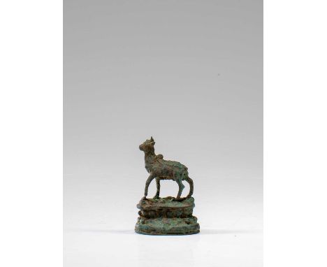 BronzeIndia , 16th century Dimensions: Height 4 cm Wide 2,5 cm Depth 1,5 cmWeight: 22 grams Statue of a young bull on a doubl