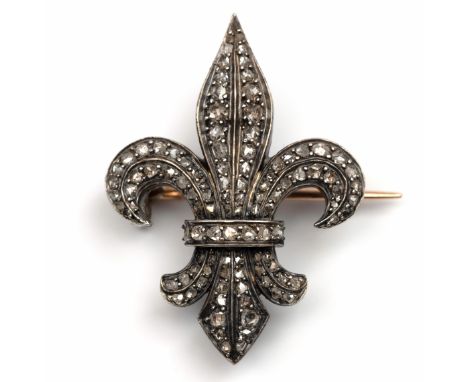 18 kt. Goud met zilveren broche, 19e eeuw. In de vorm van een Franse Lelie, bezet met roosgeslepen diamant. De achterzijde me