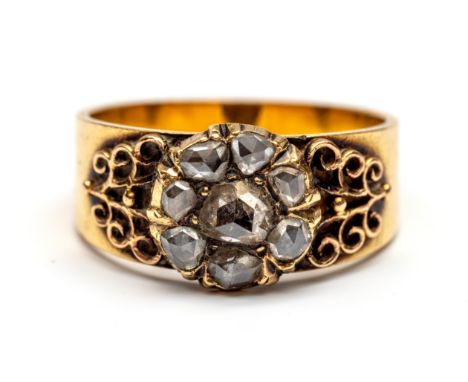 Brede 18 kt. gouden ring, de voorzijde met een rozet bezet met roosgeslepen diamant (middensteen diam. ca. 4,1 mm), aan weers