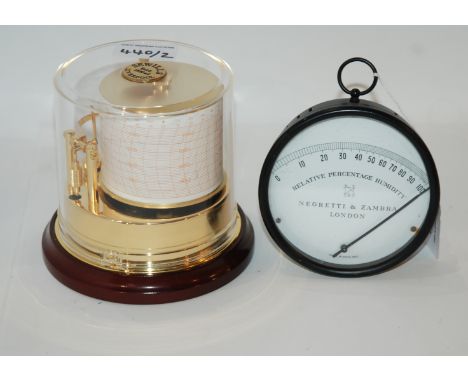 A Negretti &amp; Zambra Relative Percentage Humidity gauge, 10cm diameter and a Sewills circular barograph, 13cm high (2) Con