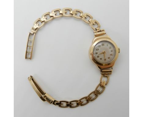 A 9ct gold ladies vintage watch, length of strap 16cm, weight including mechanism 14gms Condition Report: Available upon requ