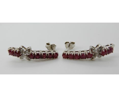 A pair of silver ruby and diamond drop earrings, length 2.5cm, stamped 925 Condition Report: Available upon request