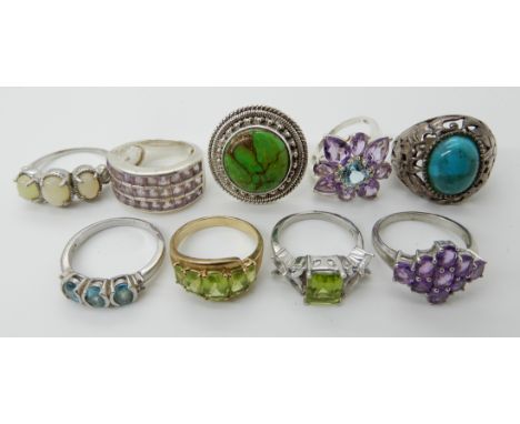 A collection of silver and white metal rings to include, amethyst, peridot etc Condition Report: Not available for this lot