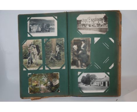 An album of vintage postcards including topographical and portrait examples Condition Report: Available upon request