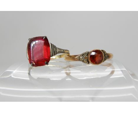 A 9ct gold garnet and pearl ring size R and a red glass set 9ct Deco ring size L1/2 Condition Report: Available upon request