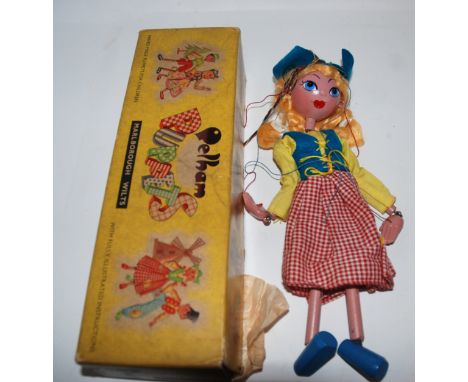 A Pelham Dutch Girl puppet in original box, soft toy and money bank Condition Report: Available upon request