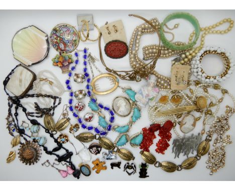 A collection of vintage costume jewellery to include a silver guilloche enamel compact (af) a retro sun pendant, a collection