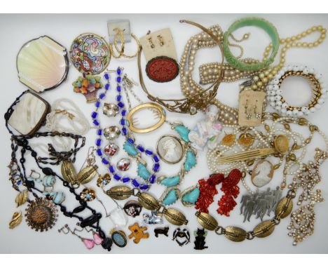 A collection of vintage costume jewellery to include a silver guilloche enamel compact (af) a retro sun pendant, a collection