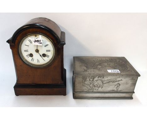A Kut Hing pewter box decorated with water buffalo and a dragon, 20cm long and a mahogany cased French mantle clock Condition