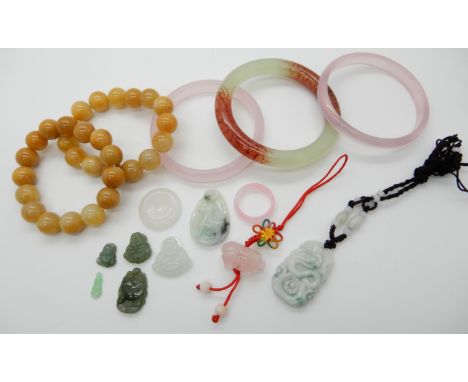 Two rose quartz bangles one facet cut, a green and red Chinese green hardstone bangle, rose quartz pig pendant, a Chinese gre
