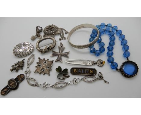 A silver bangle, a silver thistle topped bookmark and a Bairn brooch etc Condition Report: Not available for this lot