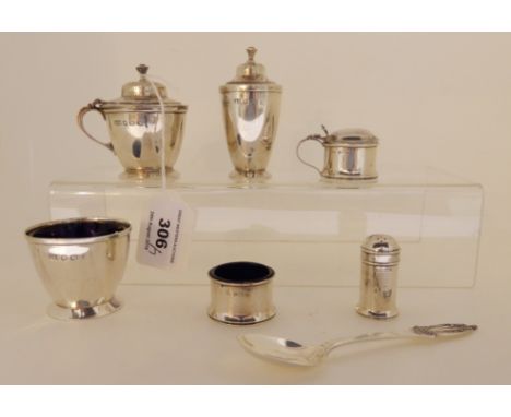 A three piece silver condiment set by Roberts &amp; Belk, Sheffield 1939, with three other silver condiments and a silver spo