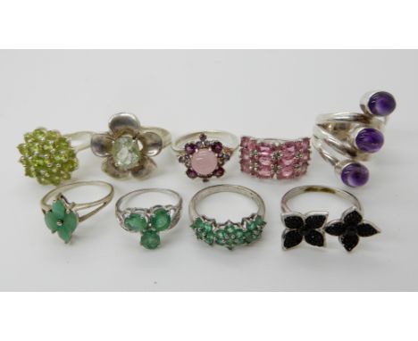 A collection of silver and white metal rings to include, amethyst apatite, peridot etc Condition Report: Not available for th