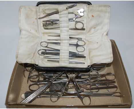 A collection of surgical tools including tonsil kit Condition Report: Available upon request