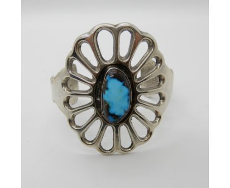 A chunky First Nation turquoise set bangle Condition Report: Not available for this lot