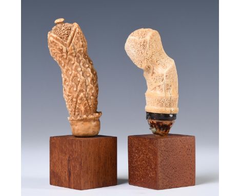 Northeast-Sumatra, Karimun Islands, two rare kris hilts, the first item made of sperm whale ivory showing a anthropomorphic j