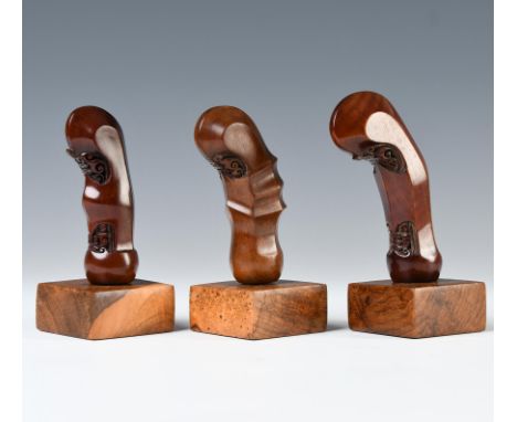 Central-Java, three wooden kris handles, the first item Jogyakarta with one patra, the other two Surakarta and shaped as youn