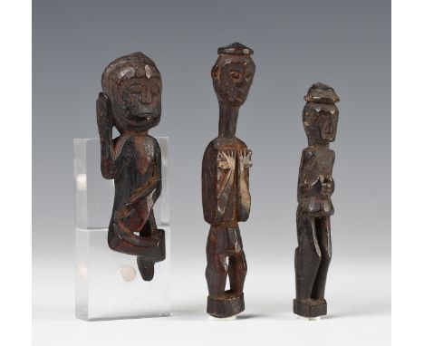 Borneo, East-Kalimantan, Tunjung Benuaq Dayak, amulets, the first item shows a figure in a ' dance'  position, right hand to 