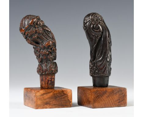 Northwest-Java, Cirebon, two wooden kris hilts, one showing an abstracted elephant head with a long flowing hair dress on the