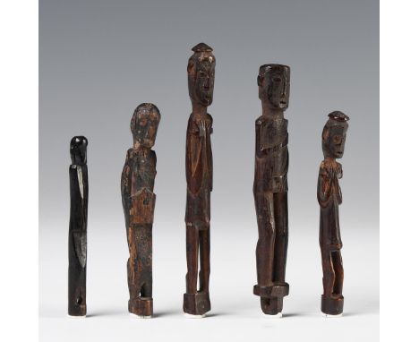 Borneo, Kalimantan, Luangan Dayak, five wooden amulets, all in a standing position, the largest with bent arms, hands touchin