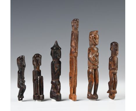 Borneo, East-Kalimantan, Benuaq-Tunjung six wooden amulets, three figures in seated positions, one with protruding tongue, th