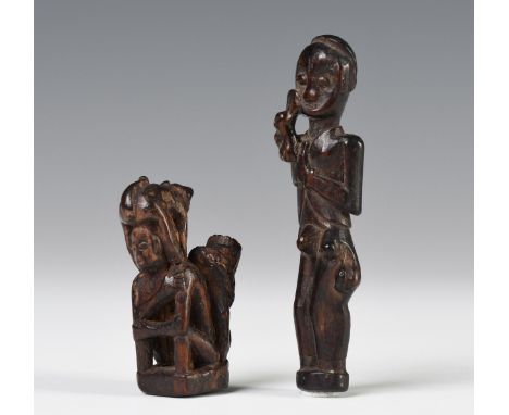 Borneo, East-Kalimantan, two Benuaq amulets, one depicts a standing figure with leprosy-related lumps to the left thigh and r