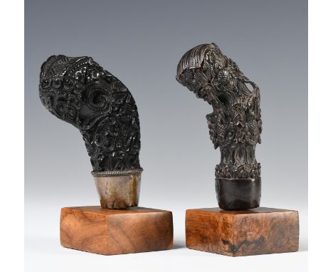 Northwest-Java, Cirebon, two wooden kris hilts, the first item shows an abstracted elephant head in a foliage guise, some det