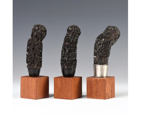 Java, one Cirebon and two East-Java/Madura wooden kris hilts, the first item a floralised Ganesha figure with silver selut, t