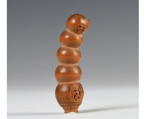 Java, Surakarta, a wooden kris handle, shaped with five superimposed bulbous segments, the upper and lower with patra, incise