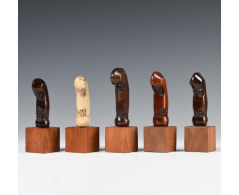 Java, Jogyakarta, four wooden and one deer horn kris hilts, all shaped as a young shoot on a trunk, the first item showing al