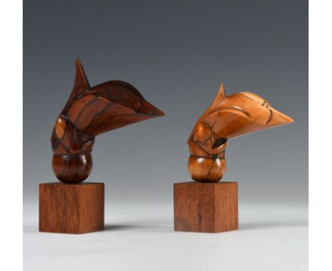 Malaysia, two kris hilts, late 19th - early 20th century, consisting of a hippo ivory bird shaped and a wooden bird shaped fi