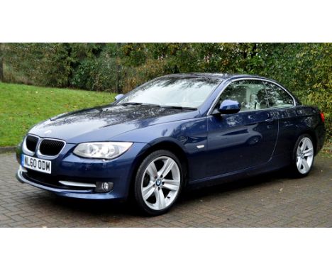 A BMW 320i SE convertible, deep sea blue, cream beige Dakota leather upholstery, electric folding mirrors, heated front seats