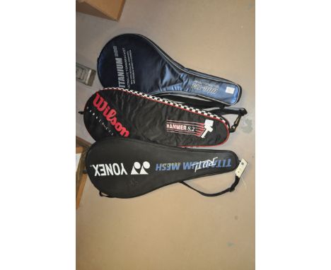 Three tennis rackets: Wilson hammer 8.2; Titanium DDC-114 Ultralite; and Yonex Isometric.  (3)