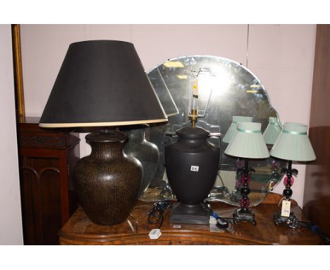 Four large modern ceramic table lamps; and a pair of small table lamps.  (6)