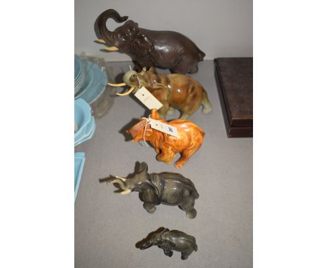 Ceramic figures of elephants, one by Royal Dux; and another resin figure.  (5)