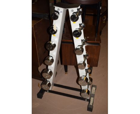A york fitness dumbell rack containing a set of six; and a York bench press.  (2)