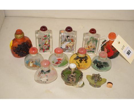 A quantity of modern Chinese snuff bottles, to include: an ambrotype with carved carp decoration, signed; clear glass with in