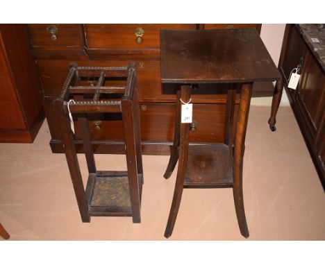 A stained wood two-tier jardiniere stand; and an early 20th Century stained oak stick stand.  (2)