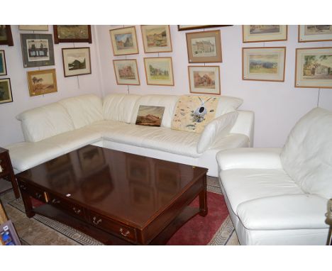 A large white leather corner sofa and matching chair "Long Life", by W. Schillig.