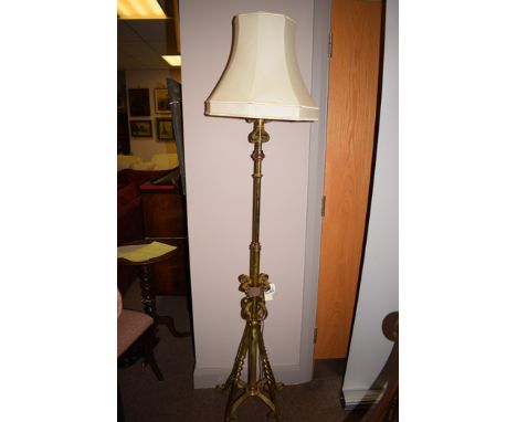 A late 19th Century/early 20th Century brass and copper adjustable standard lamp cream shade.