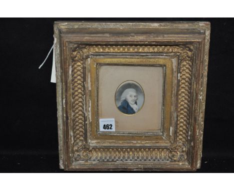 An 18th/19th Century miniature portrait on ivory - gentleman wearing a blue frock-coat, in gilt gesso frame.