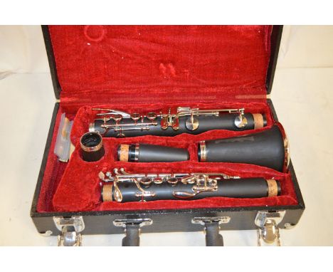 A clarinet, matt ebony stamped Y8293, in original fitted case.