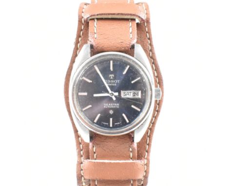 A Tissot Seastar Automatic Swiss gentleman's wristwatch. The blue dial with baton numerals, day/date aperture at the 3 o'cloc