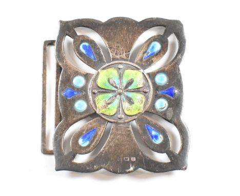 An Art Nouveau hallmarked silver and enamel belt buckle. The buckle decorated with blue green and yellow enamel stylised foli