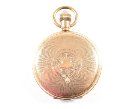 An early 20th century gold plated full hunted pocket watch. The case being engine turned with cartouche decorated centre . Th