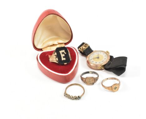 An assorted collection of Victorian and later rolled gold rings and a wristwatch. The lot to include a Victorian rolled gold 